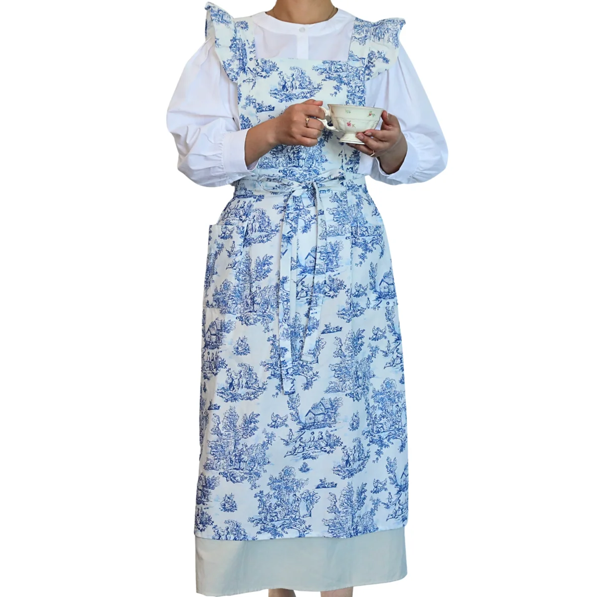 Hanee blue and white toile ruffle apron with cross-back straps and waist ties